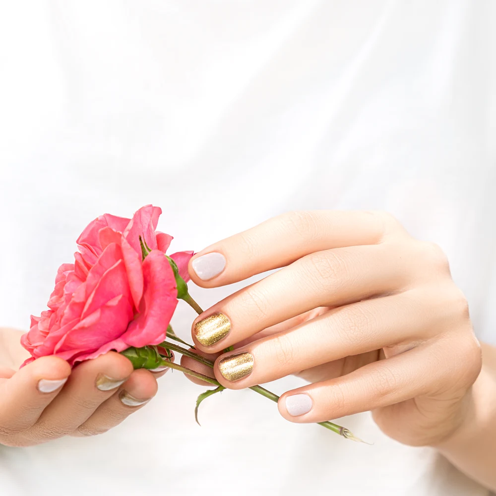Pink and gold manicure with a fresh rose at A1 Nails & Spa Duncan SC