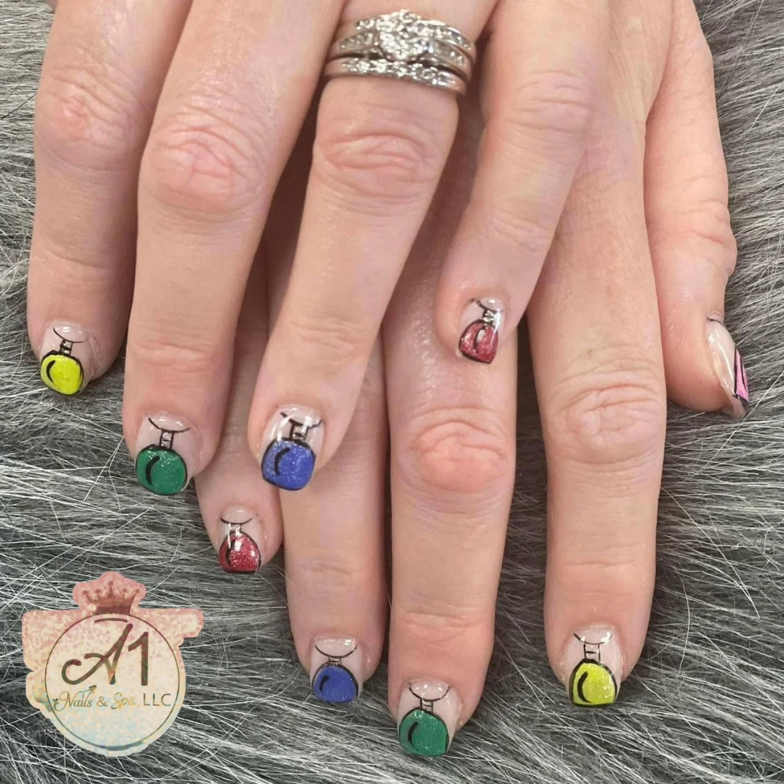 Colorful nail polish bottle nail art by A1 Nails & Spa