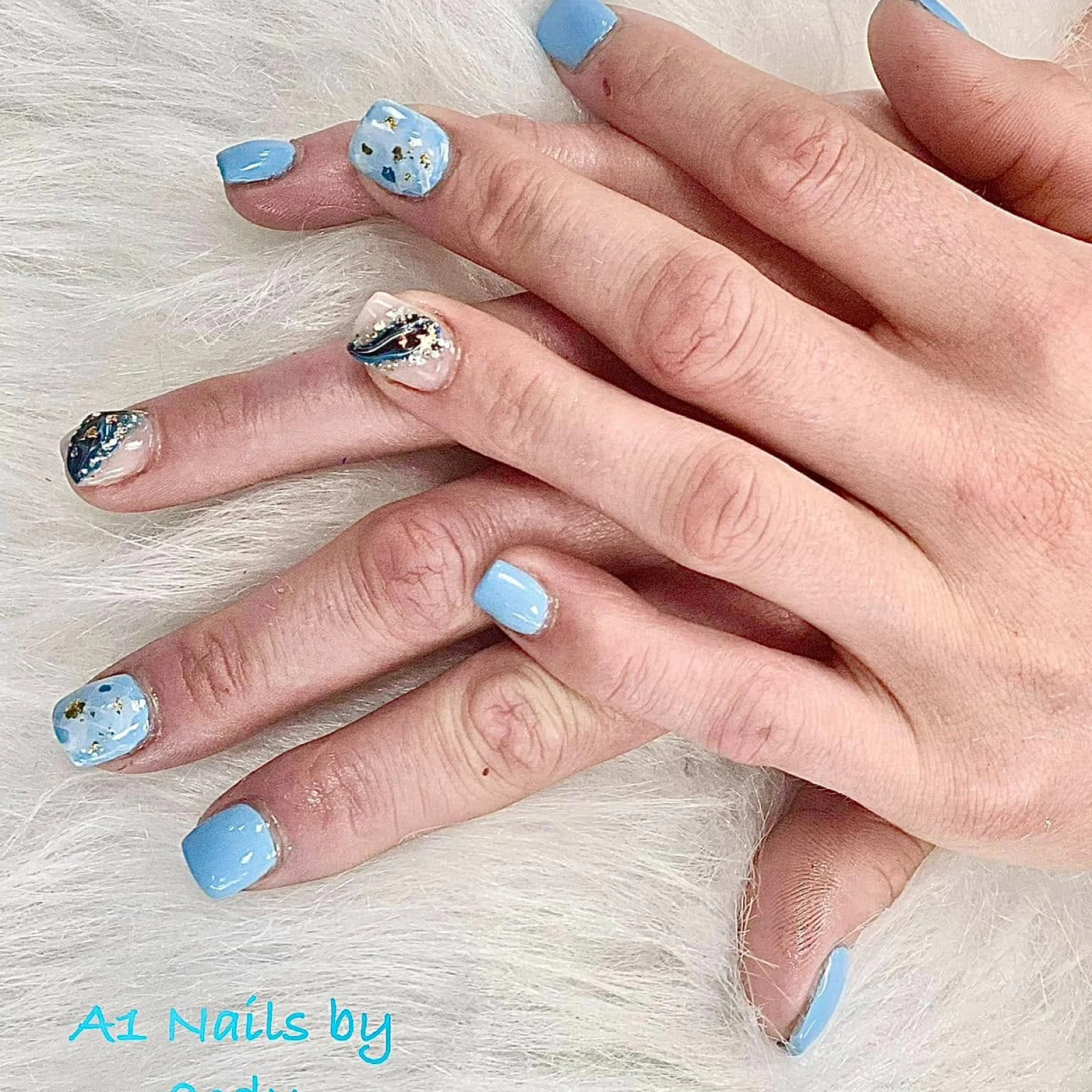 Light blue nail design by A1 Nails & Spa
